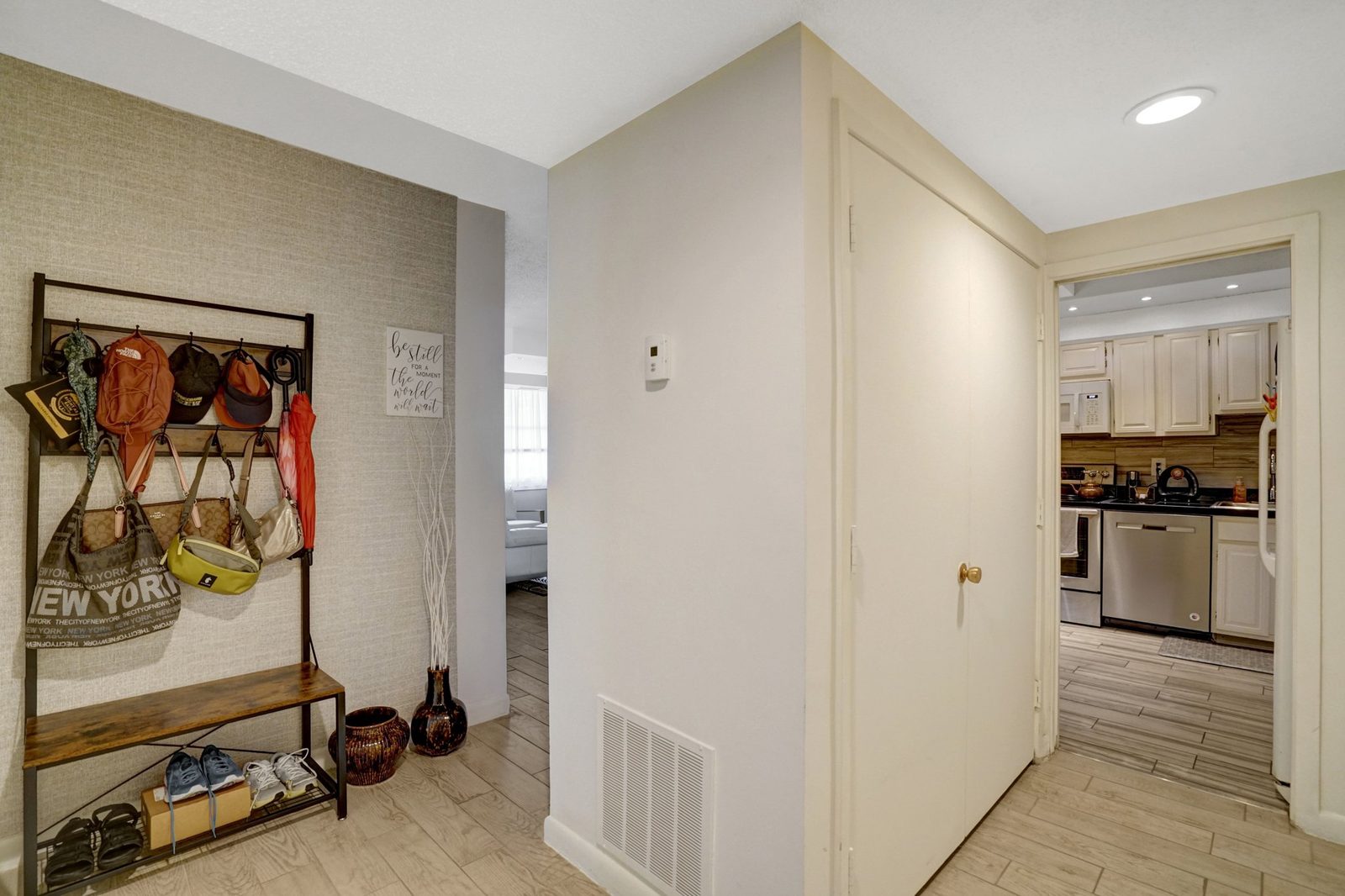 Entry area with tile floor opening into the kitchen