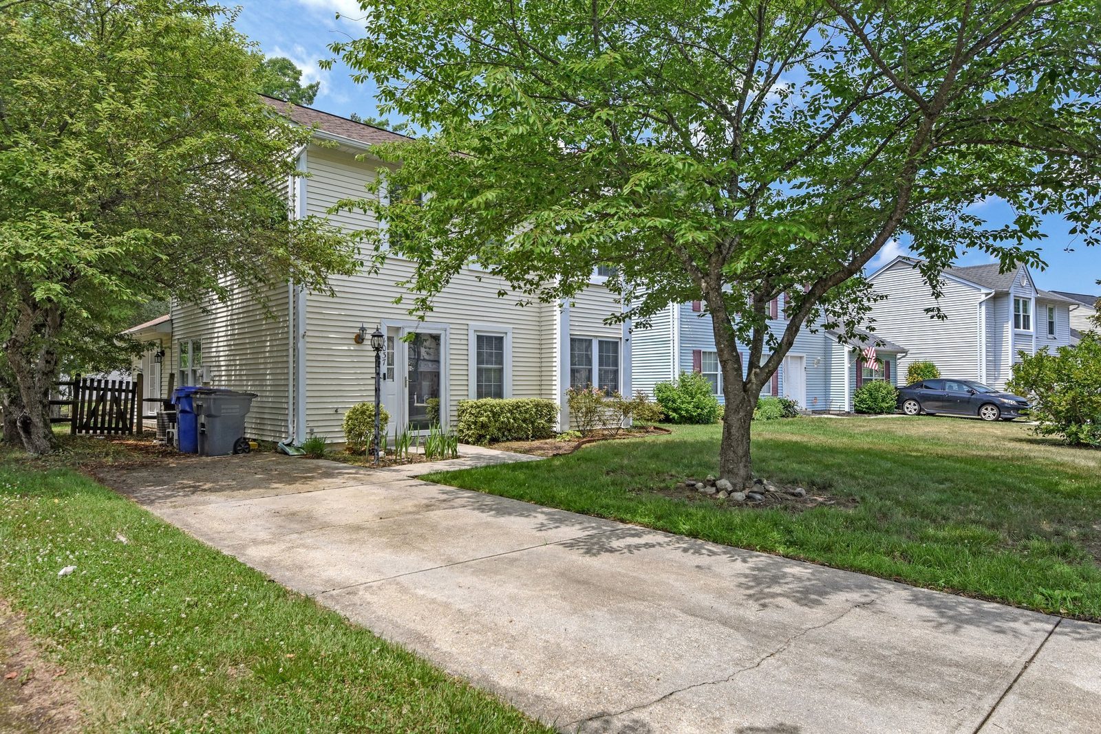Side view of home with concrete driveway and walkway